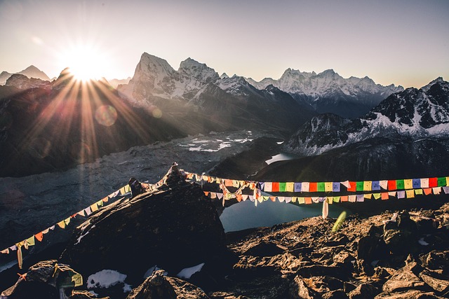 Prayer-flag dawns in Nepal with peaks turning gold in stages